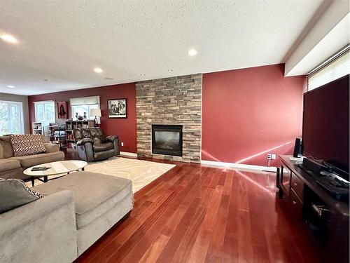 62 Baxter Crescent, Whitecourt, AB - Indoor Photo Showing Living Room With Fireplace