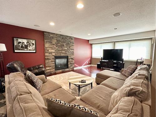 62 Baxter Crescent, Whitecourt, AB - Indoor Photo Showing Living Room With Fireplace