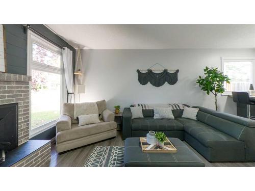 77 Feero Drive, Whitecourt, AB - Indoor Photo Showing Living Room With Fireplace