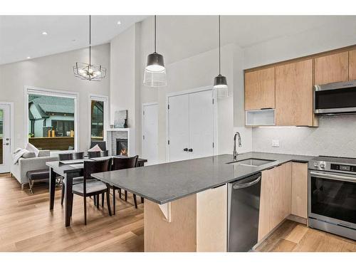 302H-209 Stewart Creek Rise, Canmore, AB - Indoor Photo Showing Kitchen With Double Sink With Upgraded Kitchen