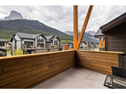 302H-209 Stewart Creek Rise, Canmore, AB - Outdoor With Deck Patio Veranda