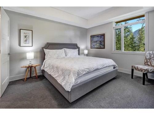 203-3000A Stewart Creek Drive, Canmore, AB - Indoor Photo Showing Bedroom