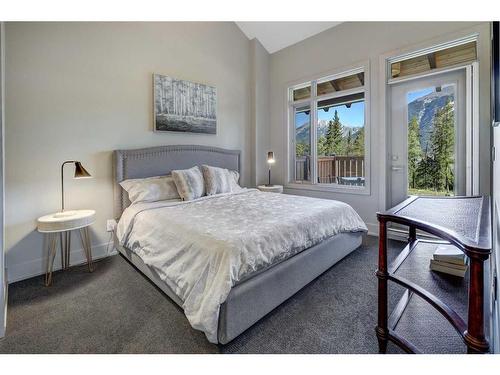 203-3000A Stewart Creek Drive, Canmore, AB - Indoor Photo Showing Bedroom