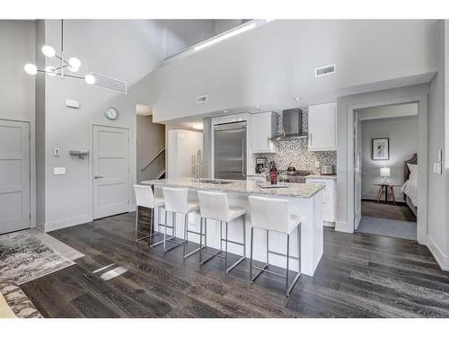 203-3000A Stewart Creek Drive, Canmore, AB - Indoor Photo Showing Kitchen With Upgraded Kitchen