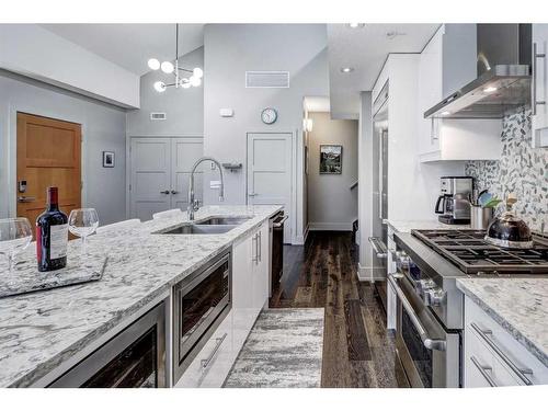 203-3000A Stewart Creek Drive, Canmore, AB - Indoor Photo Showing Kitchen With Double Sink With Upgraded Kitchen