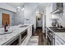 203-3000A Stewart Creek Drive, Canmore, AB  - Indoor Photo Showing Kitchen With Double Sink With Upgraded Kitchen 