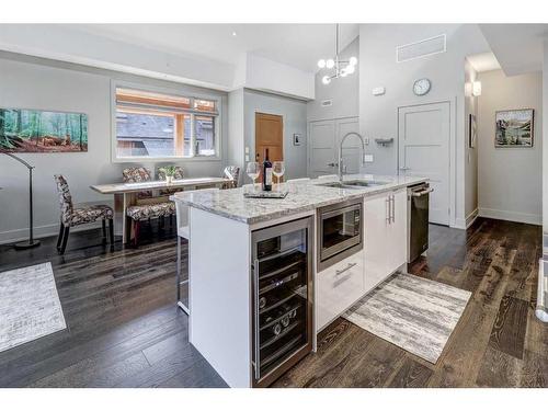 203-3000A Stewart Creek Drive, Canmore, AB - Indoor Photo Showing Kitchen With Upgraded Kitchen