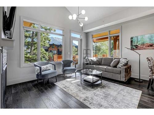 203-3000A Stewart Creek Drive, Canmore, AB - Indoor Photo Showing Living Room