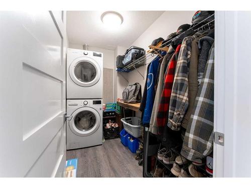 304-106 Stewart Creek Rise, Canmore, AB - Indoor Photo Showing Laundry Room