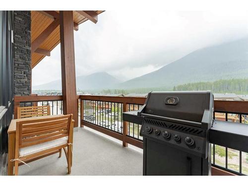 304-106 Stewart Creek Rise, Canmore, AB - Outdoor With Balcony With Exterior