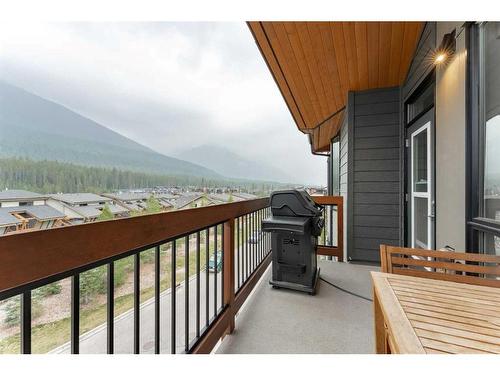 304-106 Stewart Creek Rise, Canmore, AB - Outdoor With Balcony With Exterior