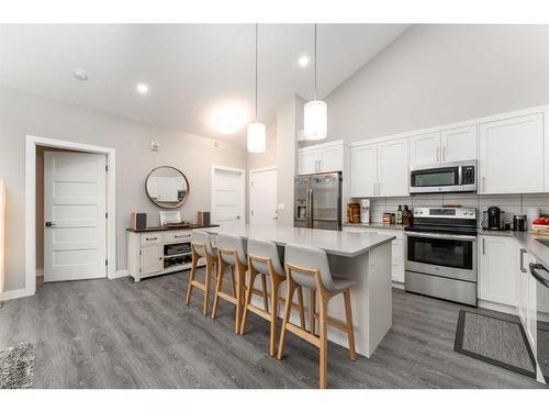 304-106 Stewart Creek Rise, Canmore, AB - Indoor Photo Showing Kitchen With Stainless Steel Kitchen With Upgraded Kitchen