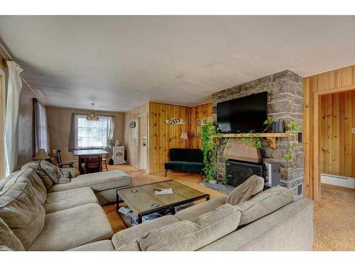 119 Wolverine Street, Banff, AB - Indoor Photo Showing Living Room With Fireplace