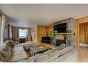 119 Wolverine Street, Banff, AB  - Indoor Photo Showing Living Room With Fireplace 