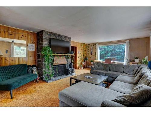 119 Wolverine Street, Banff, AB - Indoor Photo Showing Living Room With Fireplace