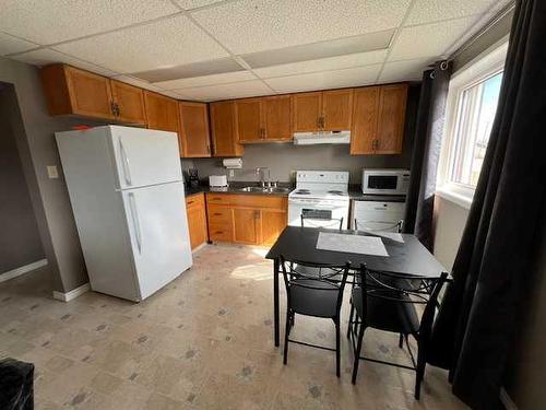 604 3 Avenue, Fox Creek, AB - Indoor Photo Showing Kitchen With Double Sink