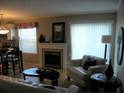 101, 202, 303, 304-2814- 48 Avenue, Athabasca, AB - Indoor Photo Showing Living Room With Fireplace