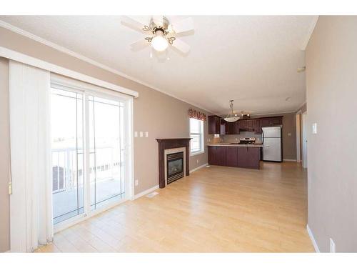 101, 202, 303, 304-2814- 48 Avenue, Athabasca, AB - Indoor Photo Showing Living Room With Fireplace