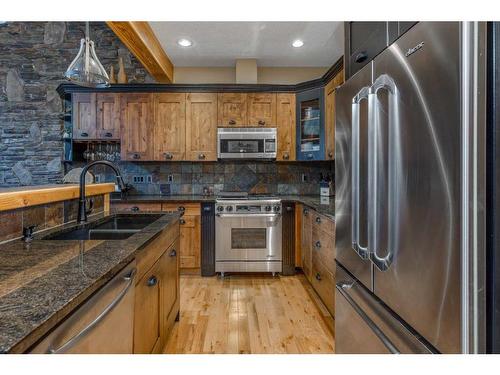 108-102 Armstrong Place, Canmore, AB - Indoor Photo Showing Kitchen With Double Sink