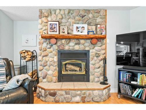 59 Ravine Drive, Whitecourt, AB - Indoor Photo Showing Living Room With Fireplace