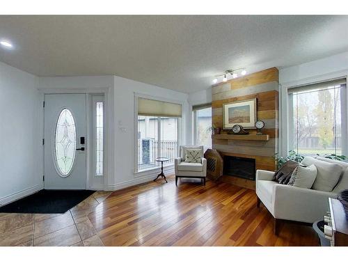 628 13 Street Se, Slave Lake, AB - Indoor Photo Showing Living Room With Fireplace