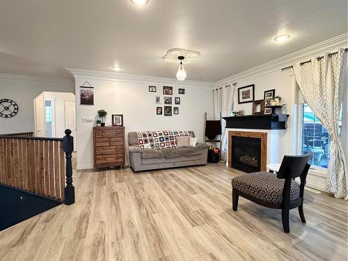 4722 44 Street, Mayerthorpe, AB - Indoor Photo Showing Living Room With Fireplace