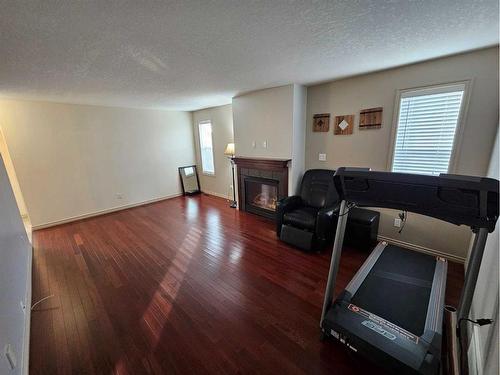 1-4034 18 Avenue, Edson, AB - Indoor Photo Showing Living Room With Fireplace