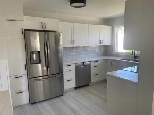 4708 56A Avenue, Whitecourt, AB - Indoor Photo Showing Kitchen With Stainless Steel Kitchen With Double Sink