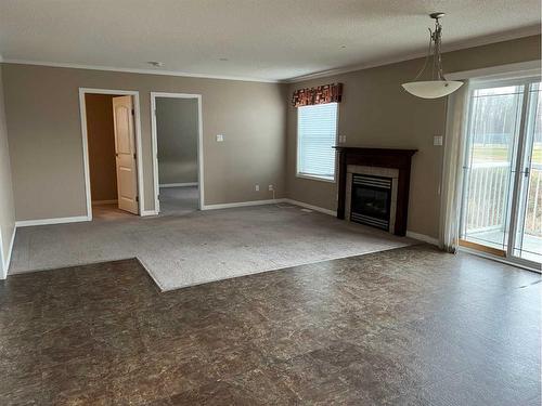 104-502 1 Street, Fox Creek, AB - Indoor Photo Showing Living Room With Fireplace