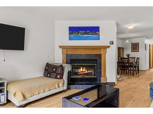 132 Cougar Point Road, Canmore, AB - Indoor Photo Showing Living Room With Fireplace