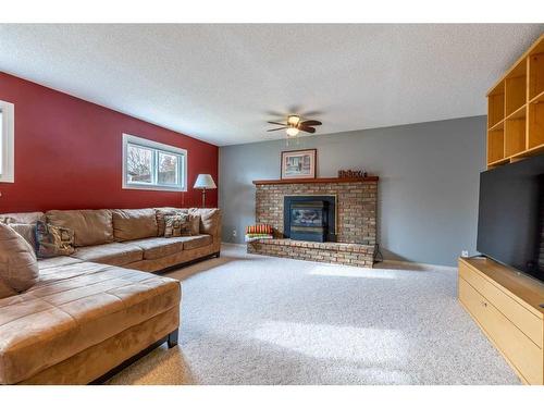 5237 16 Avenue, Edson, AB - Indoor Photo Showing Living Room With Fireplace