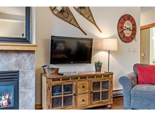 102-107 Montane Road, Canmore, AB - Indoor Photo Showing Living Room With Fireplace