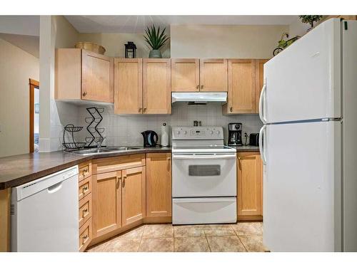 102-107 Montane Road, Canmore, AB - Indoor Photo Showing Kitchen With Double Sink