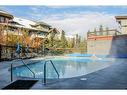 102-107 Montane Road, Canmore, AB  - Outdoor With In Ground Pool 