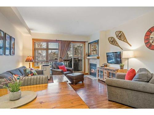 102-107 Montane Road, Canmore, AB - Indoor Photo Showing Living Room With Fireplace