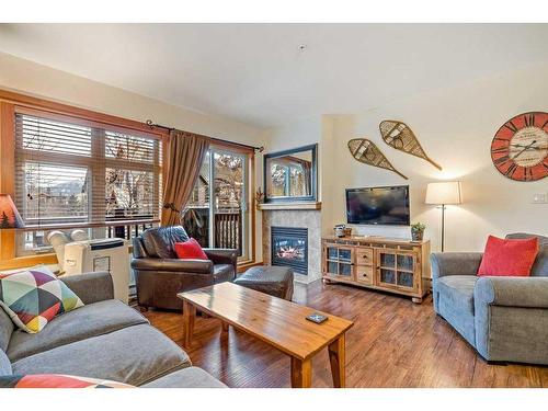 102-107 Montane Road, Canmore, AB - Indoor Photo Showing Living Room With Fireplace