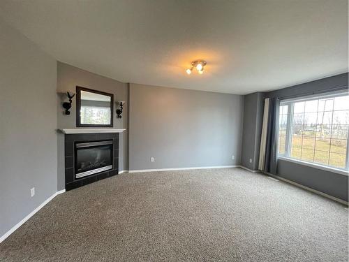 3-5010 41 Avenue, Athabasca, AB - Indoor Photo Showing Living Room With Fireplace