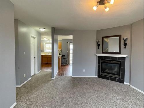 3-5010 41 Avenue, Athabasca, AB - Indoor Photo Showing Living Room With Fireplace