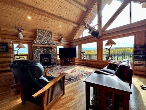 583030B Range Road 121, Rural Woodlands County, AB - Indoor Photo Showing Living Room With Fireplace