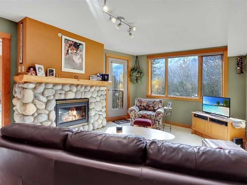 404-743 Railway Avenue, Canmore, AB - Indoor Photo Showing Living Room With Fireplace