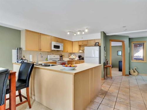 404-743 Railway Avenue, Canmore, AB - Indoor Photo Showing Kitchen With Double Sink