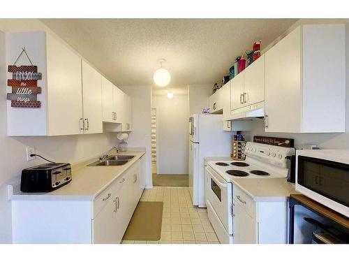 206A-5611 10Th Avenue, Edson, AB - Indoor Photo Showing Kitchen With Double Sink