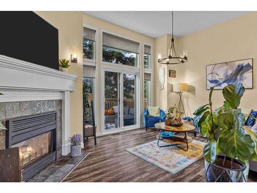 516-1080B Cougar Creek Drive Se, Canmore, AB - Indoor Photo Showing Living Room With Fireplace