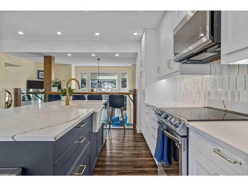 516-1080B Cougar Creek Drive Se, Canmore, AB - Indoor Photo Showing Kitchen With Upgraded Kitchen