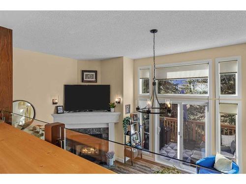 516-1080B Cougar Creek Drive Se, Canmore, AB - Indoor With Fireplace