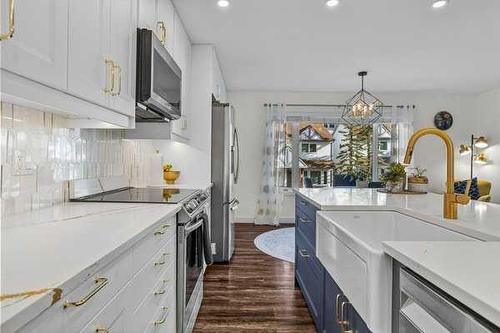 516-1080B Cougar Creek Drive Se, Canmore, AB - Indoor Photo Showing Kitchen With Upgraded Kitchen