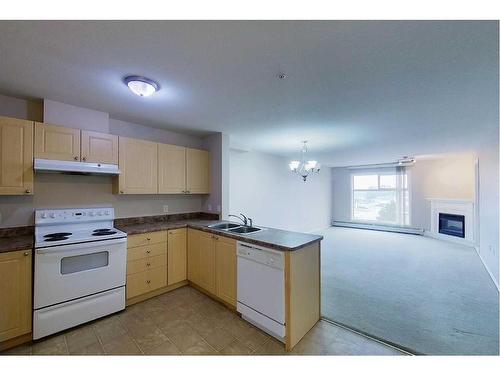 302-1615 41 Street, Edson, AB - Indoor Photo Showing Kitchen With Double Sink