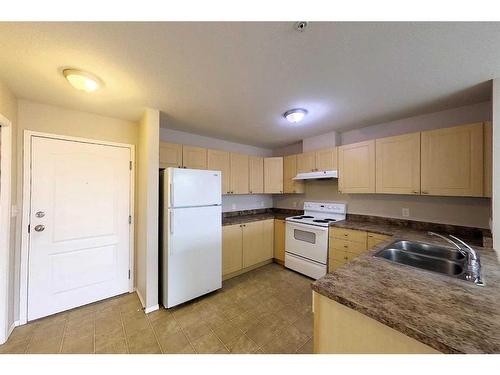 302-1615 41 Street, Edson, AB - Indoor Photo Showing Kitchen With Double Sink