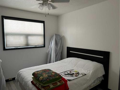 407 7 Avenue, Fox Creek, AB - Indoor Photo Showing Bedroom