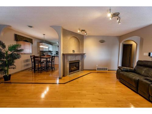 113 Parker Place, Hinton, AB - Indoor Photo Showing Living Room With Fireplace